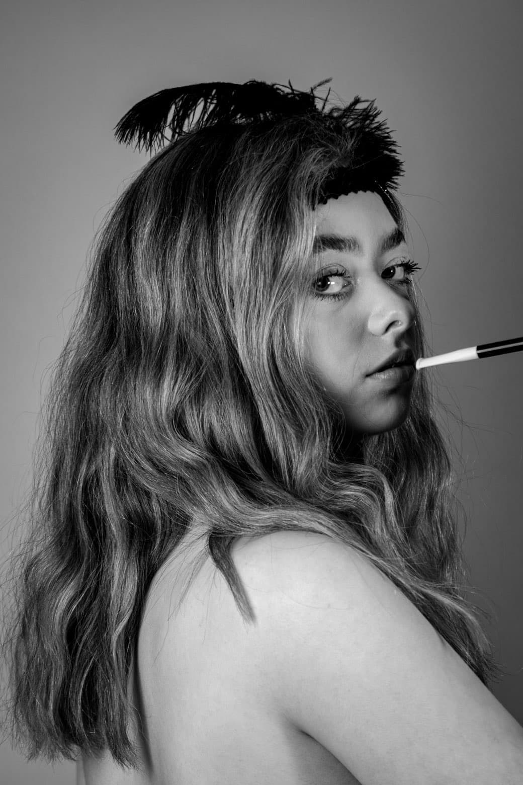 Black and white editorial portrait with a cigarette